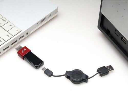 Two computers connected by a USBC cable 